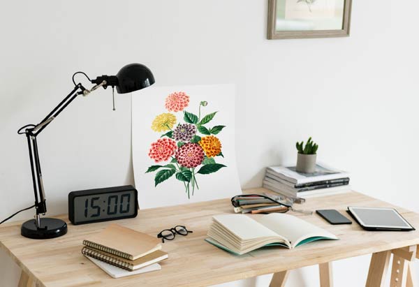 Modern home office with books and writing supplies