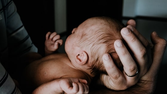 parent holding a newborn