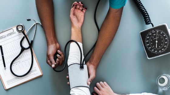 Nurse taking a patients blood pressure