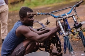 man working on electric bike.