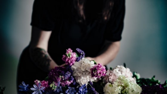 person arranging flowers.
