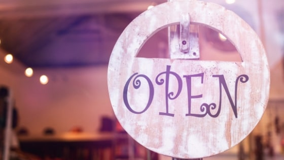 window with 'open' sign.