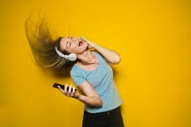 girl listening to music with headphones.