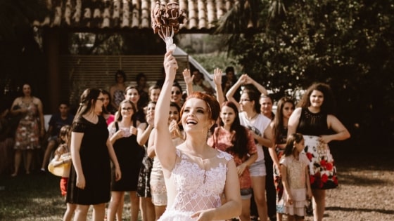 bride throwing wedding bouquet